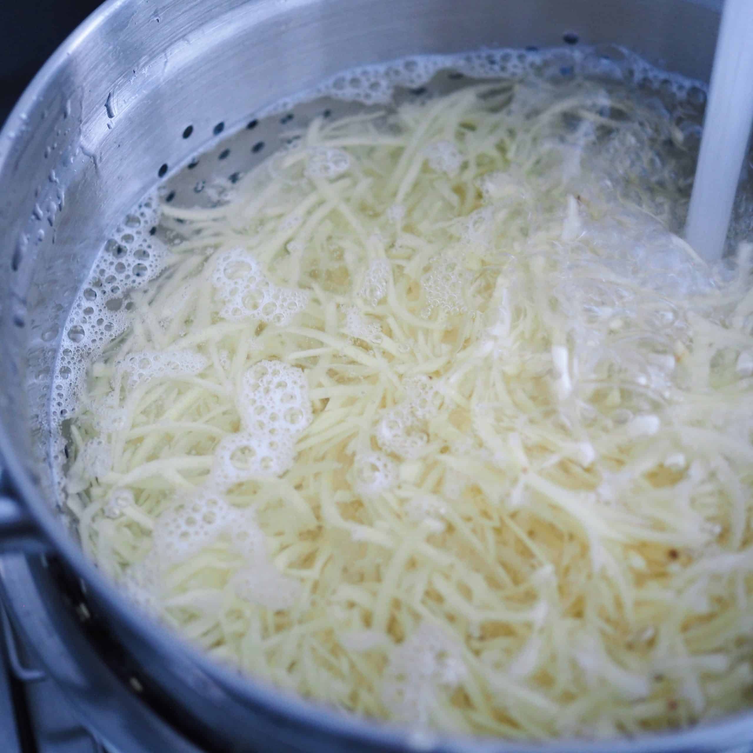 Rinse Grated Potatoes with Cold Water