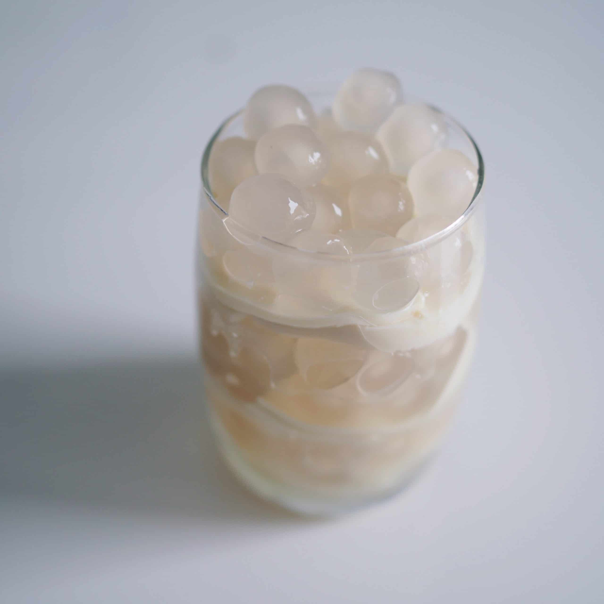 layer tofu and tapioca pearls in a bowl or glass