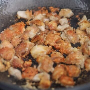 Heat vegetable oil on medium-high heat in a large pan. Carefully lower coated chicken into oil and quickly spread apart. Allow pieces to sear and form a golden crust, about 5-6 minutes on each side and avoid stir-frying them around until you're ready to flip.