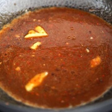 In the same pan on medium-high heat, add ginger followed by pre-mixed sauce. Let it come to a boil to thicken and reduce.