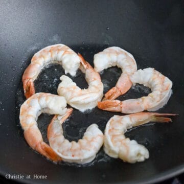 Heat vegetable oil in a large pan on medium heat. Fry shrimp until pink, curled and cooked through. Remove and set aside. Do not overcook them.