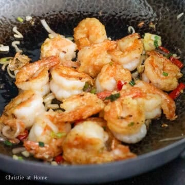 Toss back in cooked shrimp. Then add sugar, fish sauce and sesame oil in that order. Toss everything together and remove off heat to enjoy. 