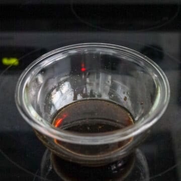 Soy sauce, sesame oil, and brown sugar mixed in a small bowl.