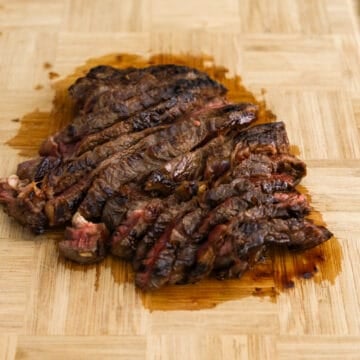 Remove steaks from pan and let them rest on a cutting board for 10 minutes before slicing.
