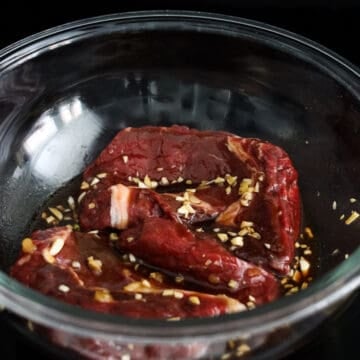 In a large bowl, mix together Marinade ingredients (as listed) until combined. Add steaks to marinade and coat the steaks in the marinade evenly. Marinate for 15 minutes as you prepare the dipping sauce. 