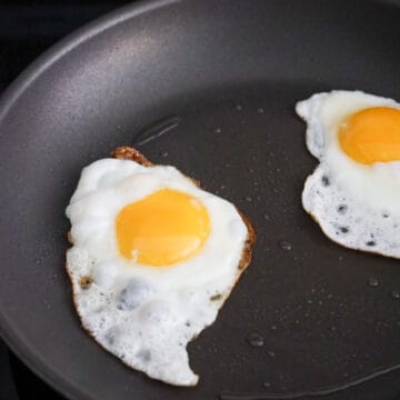 Heat vegetable oil in a frying pan on medium heat. Fry eggs sunny side up until edges are crispy brown and the egg whites are set. Or feel free fry them easy-over or scramble them. Transfer a cooked egg on top of the macaroni pasta per bowl. 