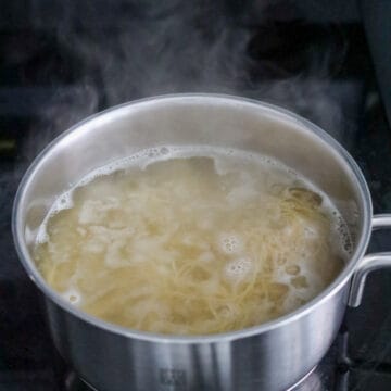 Heat a large pot of boiling water on high heat, add fresh wonton noodles. Loosen noodles and blanch for 10 seconds or just until al dente. Do not over blanch them!  Immediately strain and transfer to a large serving bowl. Optional: Feel free to rinse the hot noodles in cold running water to shock them and to stop the cooking process but make sure to shake out as much excess water as possible.