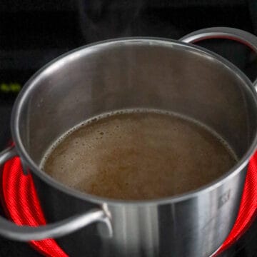 In a medium-sized pot on high heat, add water, chicken stock, oyster sauce, regular soy sauce, chicken bouillon powder, sesame oil. Mix well. Cover and bring to a boil.