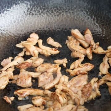 In a large pan on medium-high heat, add 1 tablespoon of oil and fry chicken until cooked through and remove.