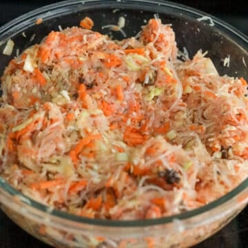 Add ground pork, carrots, cabbage, mushrooms, onions, eggs, salt, black pepper and sugar to the noodles. With clean hands, mix well. Take about 1 tablespoon of the filling and pan fry or microwave for 40 seconds until cooked to taste test it. If needed, adjust the seasoning by adding more salt, black pepper or sugar. Set aside.