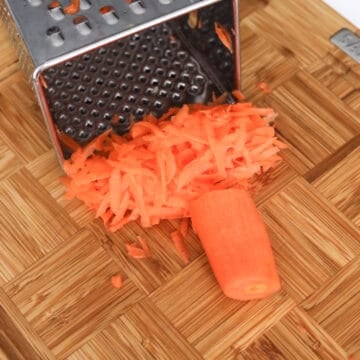 Prepare carrots, cabbage and onion by grating them with a box grater or use a food processor with the smallest grate setting in place.