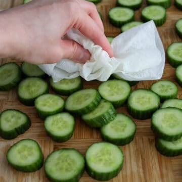 Pat cucumbers dry with clean paper towels or a clean kitchen towel. Transfer back into a large clean bowl.