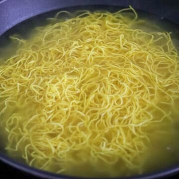 Then bring a large pan filled halfway with water to boil on medium-high heat. Blanch chow mein noodles for 20-30 seconds or until loosened.