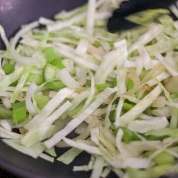 Heat 1 tablespoon or 15 ml vegetable oil in a large pan. Fry onions, cabbage and celery until softened, about 1 minute.