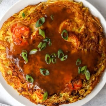 Pour thickened gravy over omelet and garnish with chopped green onions.  