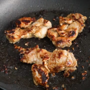 Reduce to medium heat and flip chicken over and fry on the other side for 2 minutes until browned and juices run clear or an internal temperature of 165 F. Immediately remove cooked chicken from pan. Make sure to clean the pan of the burned marinade between batches and add another tablespoon of vegetable oil to fry the next batch.