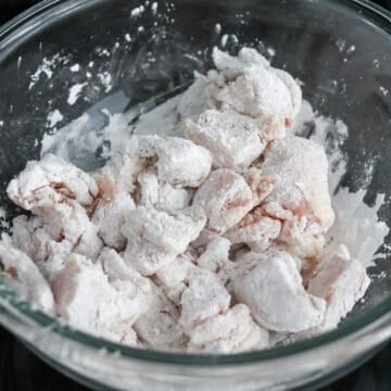 Into your large bowl of diced chicken, add cornstarch. Toss until chicken is evenly coated in starch. 