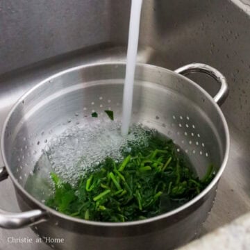 strain the cooked spinach and rinse with cold water