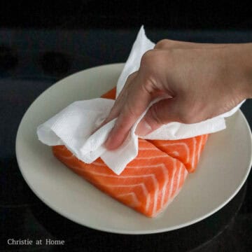 Pat the salmon flesh very dry with a clean paper towel to remove excess moisture. 