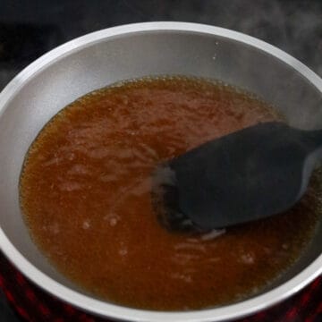 In a small frying pan (7-8 inches wide) on medium heat, add chicken broth or dashi stock, regular soy sauce, mirin and sugar.