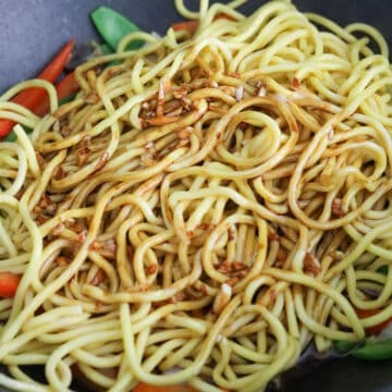 Reduce to medium heat. Add in cooked noodles and prepared lo mein sauce.