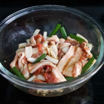 Transfer sliced pork belly to a large mixing bowl. Add marinade ingredients to the bowl and mix well with pork. Cover and marinate for at least 15 minutes or overnight. 