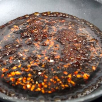 Add the sauce into the pan and simmer to thicken. 