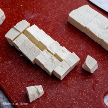 Pat dry the tofu with paper towels to remove excess moisture and dice into ¾-inch cubes. Set aside. 