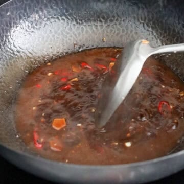 Stir-fry ginger, garlic, and red chili and add hoisin sauce, soy sauce, brown sugar, sesame oil and the cornstarch slurry - simmer to thicken.