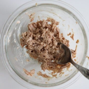 First, combine strained tuna and mayo and mix well. Set aside. 