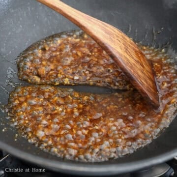 Heat a dry wok or small to medium pan over medium heat. Pour in the sauce and simmer to thicken, about 30 seconds.