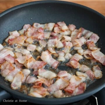 Heat a large pan on medium heat, fry bacon until cooked and slightly browned on the edges, about 4-5 minutes. Transfer the cooked bacon to a plate, draining off any excess grease. Leave about 1 teaspoon of bacon grease in the pan and discard the rest.
