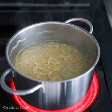 Then in the same pot filled with water, bring to a boil on high heat. Loosen the wonton egg noodles with your hands, before lowering them into the boiling water. Blanch noodles for 15-20 seconds or until loosened and strain. Do not over blanch! 