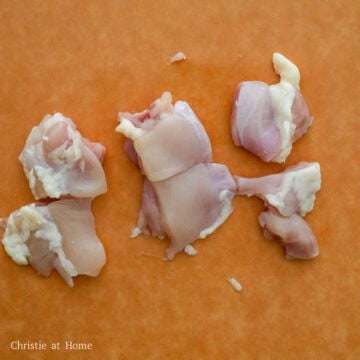 Dice chicken thighs into 1.5-inch cubes and transfer to a large mixing bowl. 