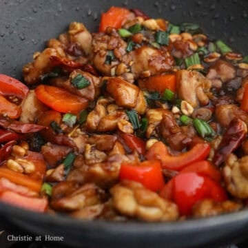Toss in cooked chicken, followed by the sauce. Stir fry for 30 seconds until chicken is evenly coated in sauce. Serve and enjoy!