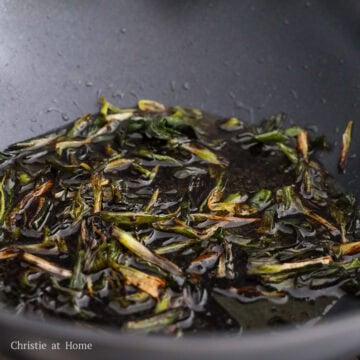 Mix in the sauce with scallions and oil.
