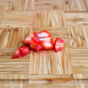 Slice the tops off of the remaining strawberries and dice it into small cubes. 