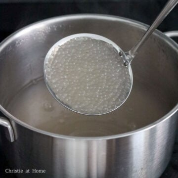 In a medium pot with 5 cups or 1250 ml water, bring to a boil on high heat. Add tapioca pearls, reduce to medium heat and cook for 10 minutes, stirring occasionally. Then turn off the heat, cover and soak the tapioca in the hot water for 10-15 minutes until translucent. If there is a white dot in the center of the tapioca, soak covered for 2-3 minutes.