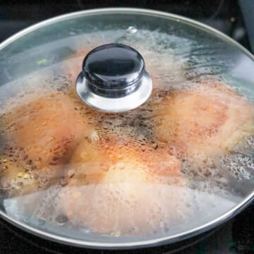 Remove the lid, flip the chicken over so it's skin side up. Cover and simmer for another 10 minutes.