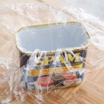 Line the clean spam can with a large piece of plastic wrap.