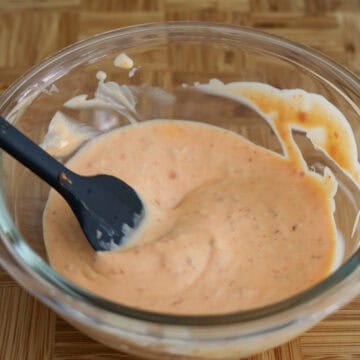 Sauce ingredients being mixed together in a small bowl.