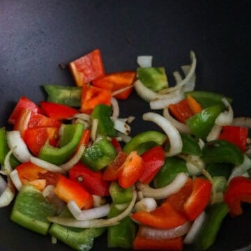Fry onions and bell peppers for 30 seconds.