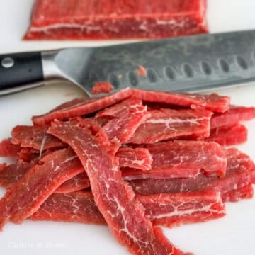 Slice flank steak against the grain at a 45-degree angle into ¼-inch thick pieces.