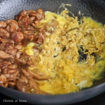 Heat vegetable oil in a large pan on medium heat. Fry chicken until 75% cooked. Push to the side of the pan, pour in beaten eggs and scramble them. Then mix everything together and push to the side. 