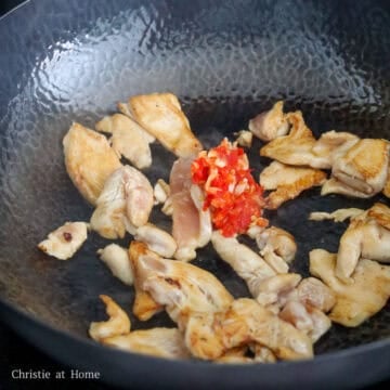 add chili paste to pan with chicken