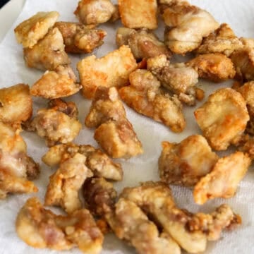 Transfer fried chicken to a wire rack or paper towel-lined plate.