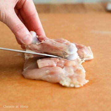 Place chicken thighs skin-side down on a cutting board. Then with the tip of a sharp knife, make small slits around the bone until you can remove it. Pat dry the chicken thighs on both sides with paper towel to remove excess moisture, especially the skin.
