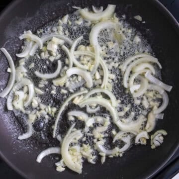 Heat a large pan on medium heat and melt butter. Sauté garlic and onions until softened, about 1-2 minutes 