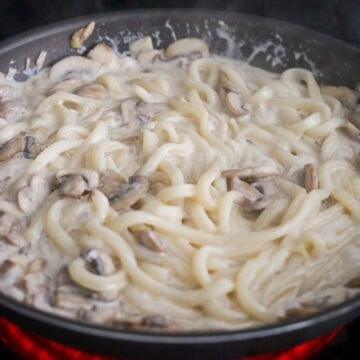 Once sauce has thickened a bit. Toss in strained udon noodles and cook for 2 minutes. 