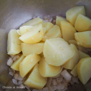 combine potatoes with onions and seasoning